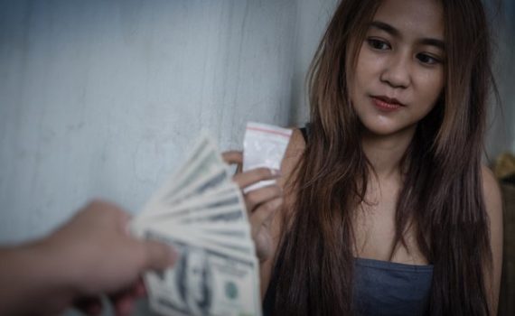 Teen buying drugs