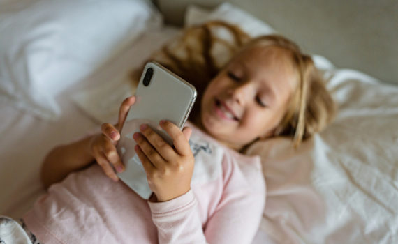 Young teen looking at her phone
